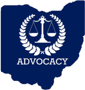 Solid blue Ohio form imposed with white balance scales encircled by olive branches with the word advocacy below.